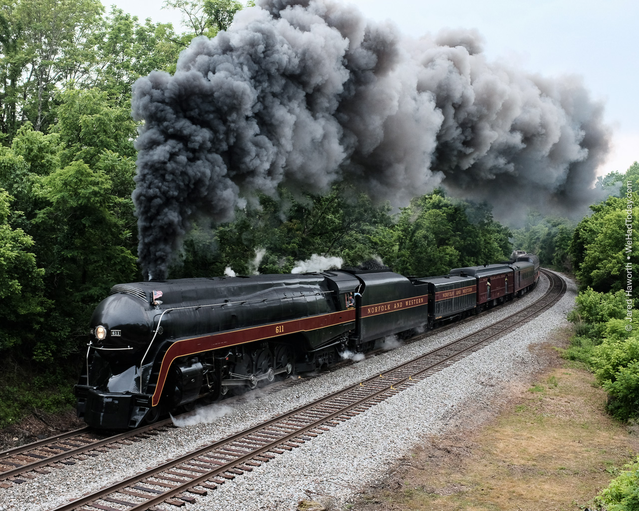 Rounding a curve, the 611 nears the summit in Blue Ridge, passing between the remains of a 1950s era bridge over the tracks.