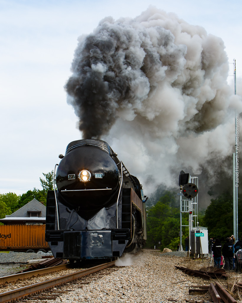 611 billows out a large cloud of smoke as she comes around the curve at Pamplin Station.