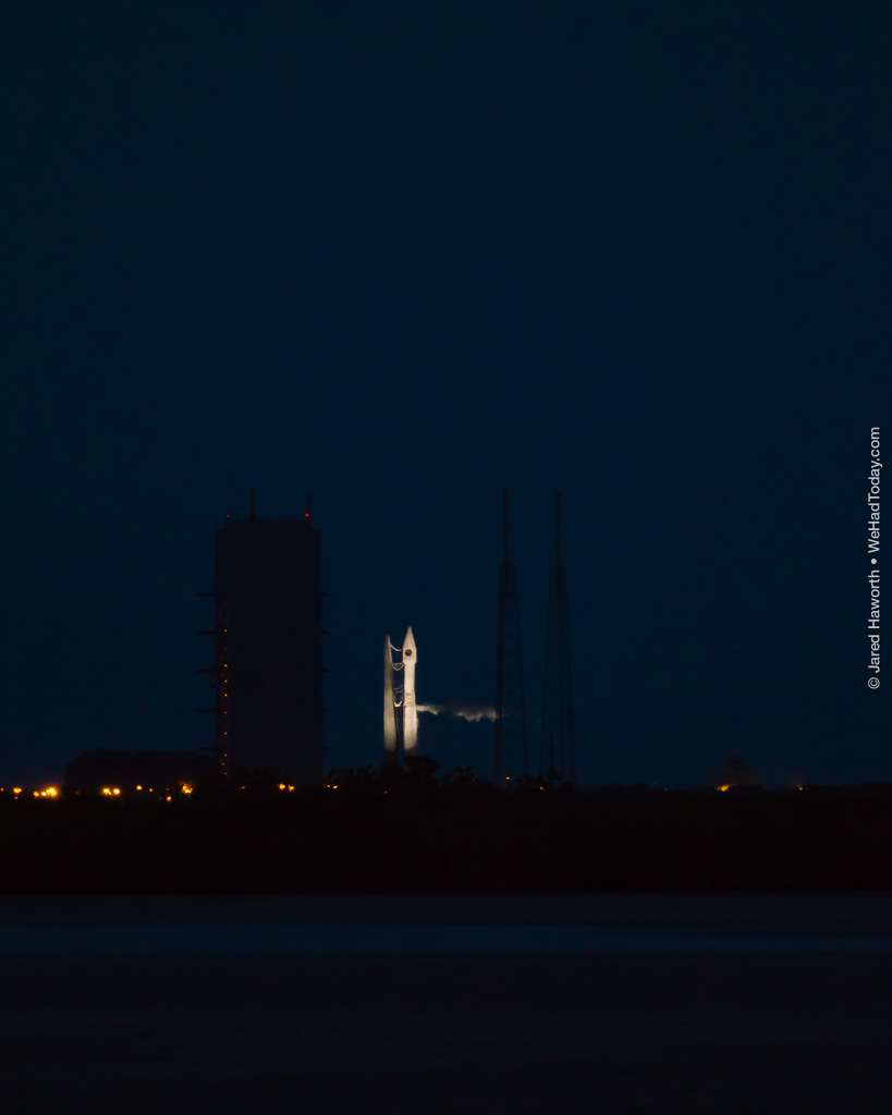 A United Launch Alliance Atlas V launch vehicle stands ready at twilight.