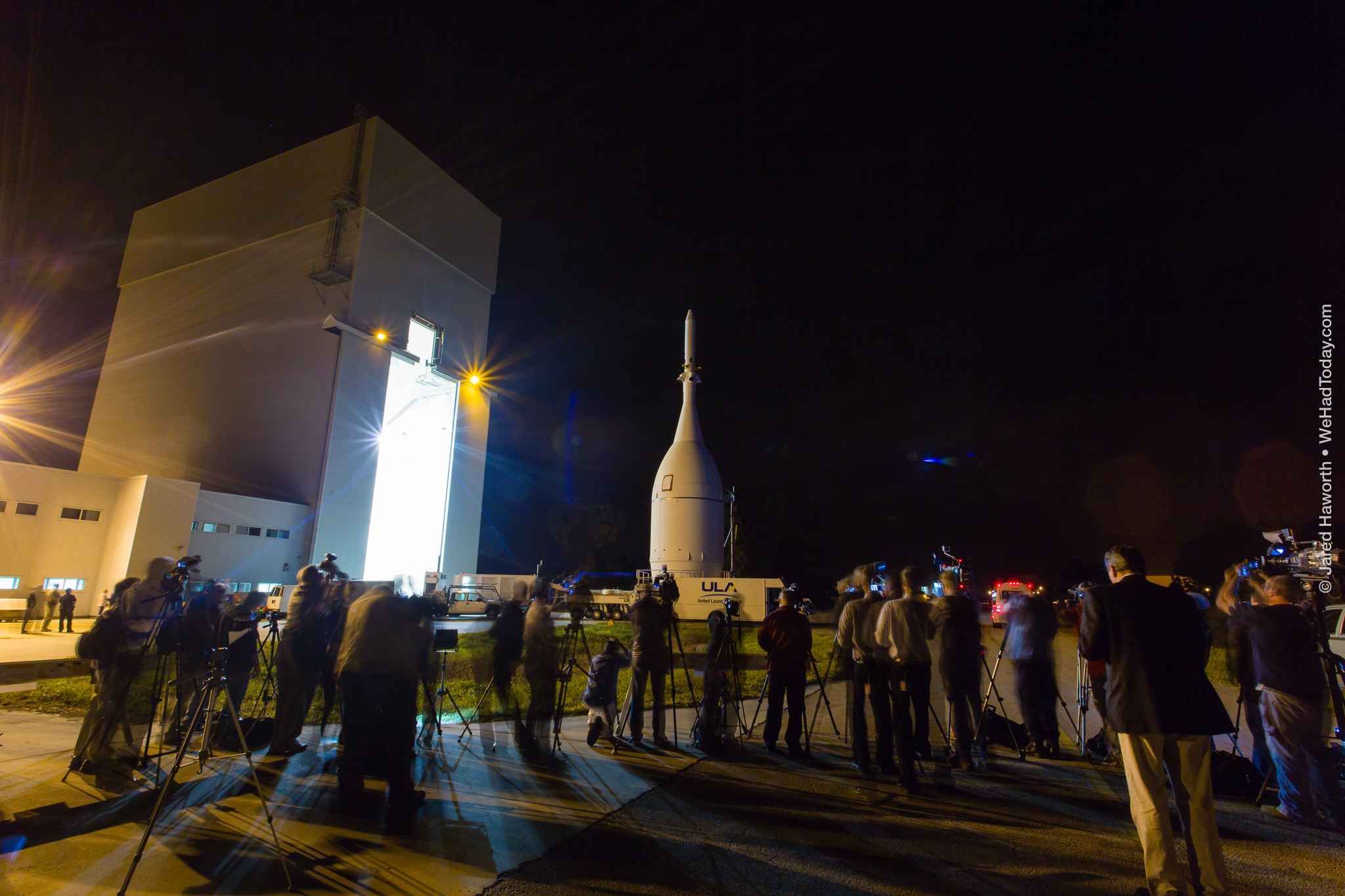 Members of the press get their first view of the completed Orion stack.