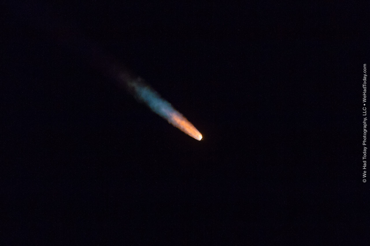 As the five solid rocket boosters expend their propellant, the flame trail of the rocket changes from yellow to orange to white while the rocket streaks downrange.