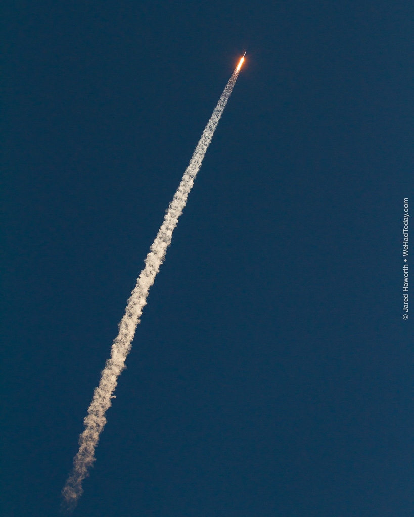 The Falcon 9 first stage leaves a frosty contrail in the upper atmosphere on its journey to orbit.  Photo credit: Jared Haworth / We Report Space
