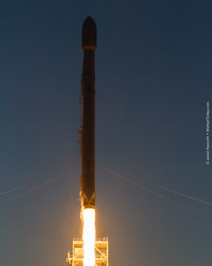 Backlit by the setting sun, the Falcon 9's nine Merlin 1D engines illuminate the bottom of this image.  Photo credit: Jared Haworth / We Report Space